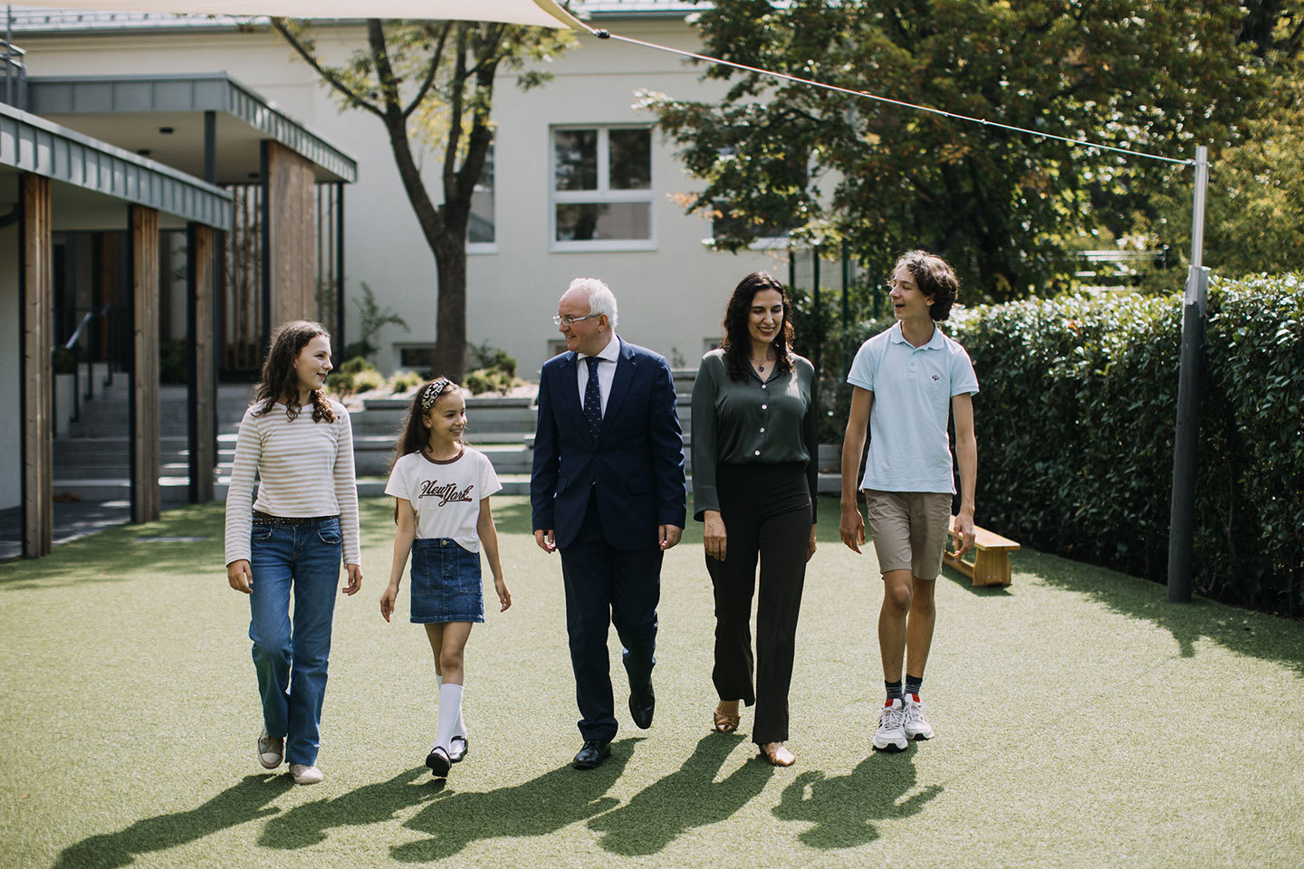 Mr. King in the grounds of the School with his family, wife Loredana, son Octavian and daughters Annabelle and Alexandra.